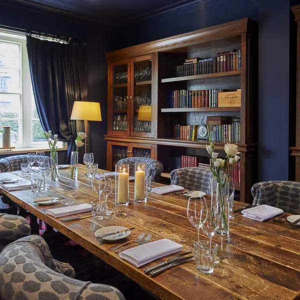 A beautifully arranged dining table with elegantly set place settings.