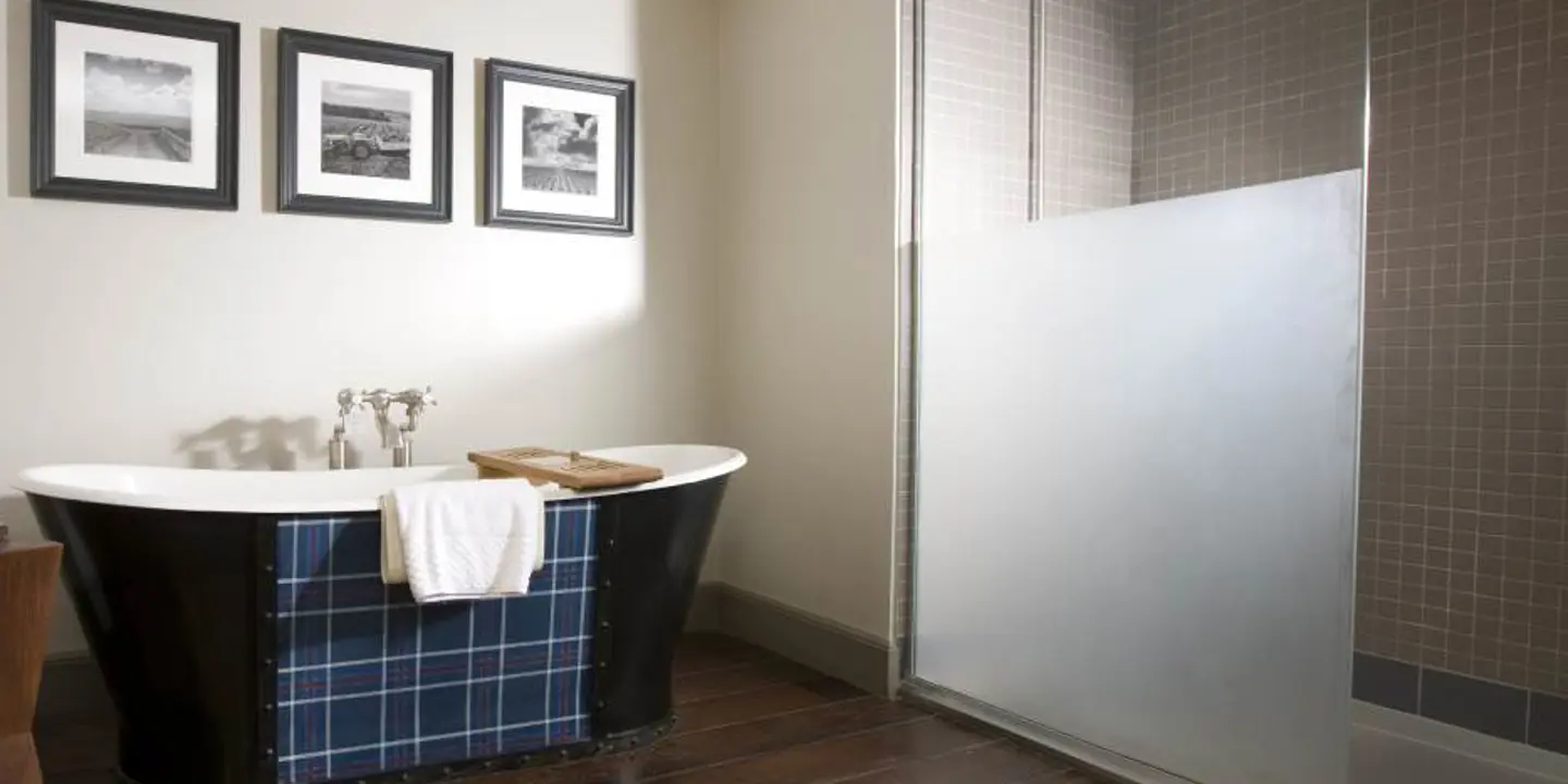 Bathroom featuring a bathtub and shower