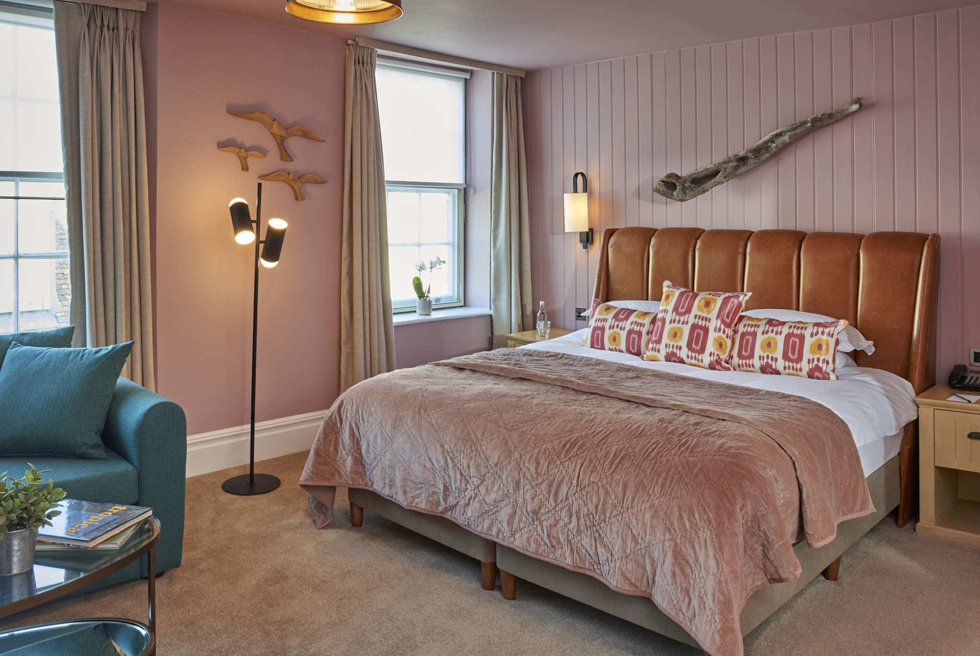 Bedroom featuring a comfortable bed and chair.