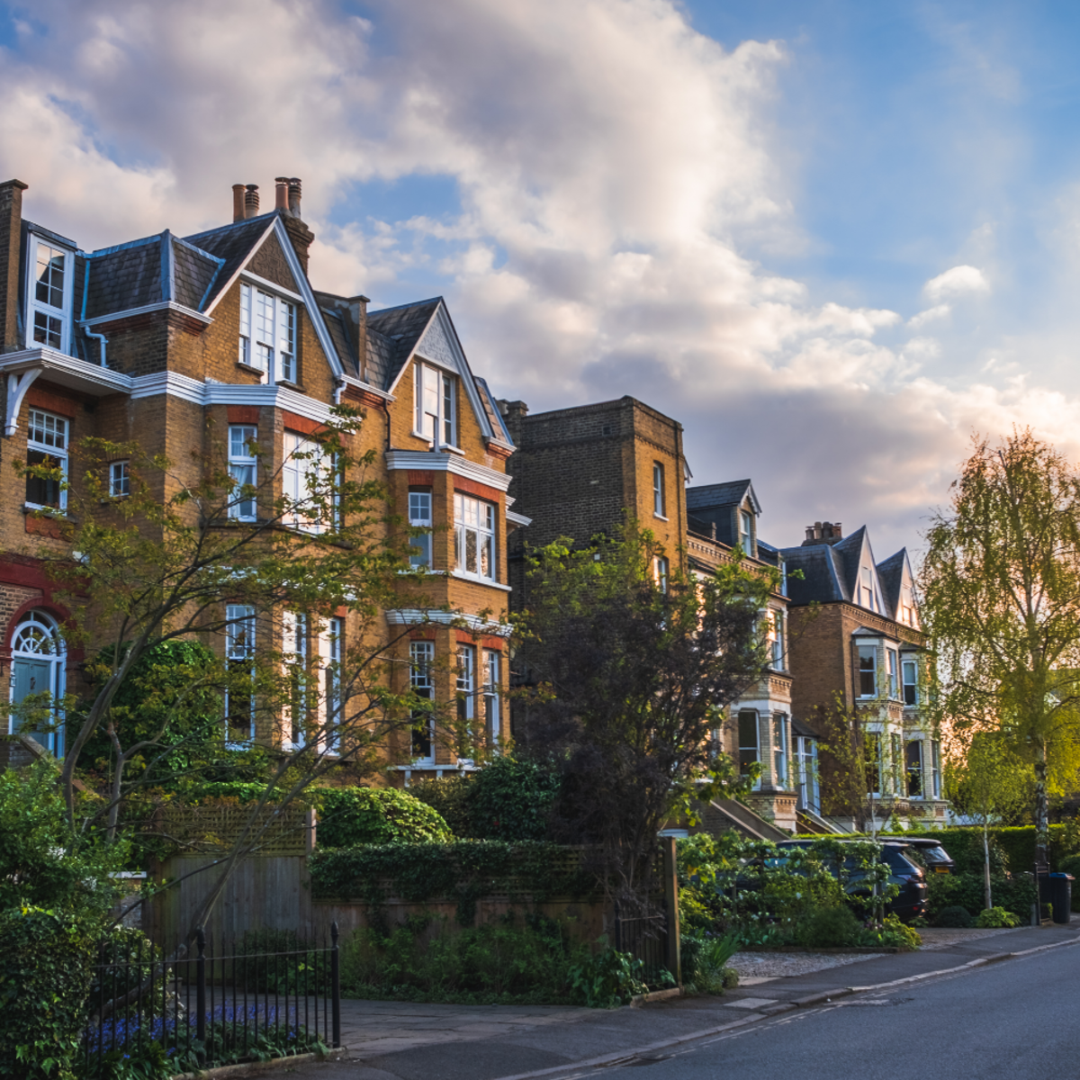 Residential street with a row of houses.