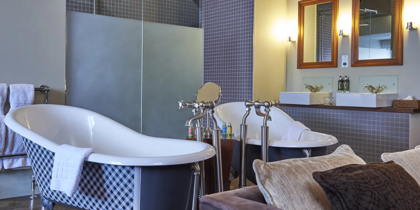 Bathroom with a bathtub placed alongside a sink