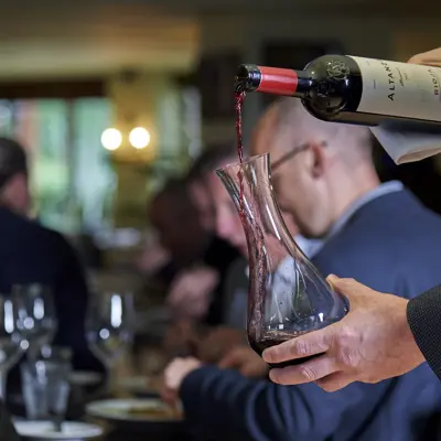 Man pouring red wine