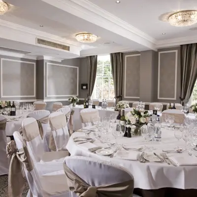 An elegantly arranged banquet room for a formal event.