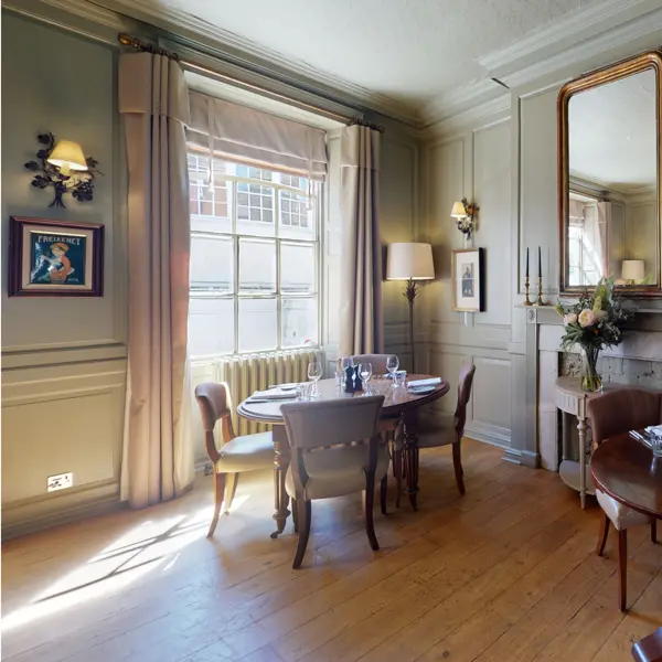 Dining room featuring a table and chairs.