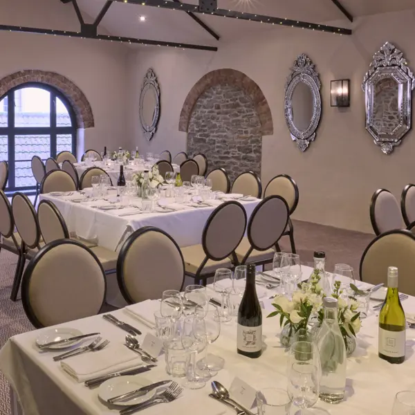 A beautifully arranged dining table with elegant place settings.